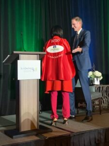 Kidango CEO Scott Moore presented Dr. Burke Harris with a special red cape