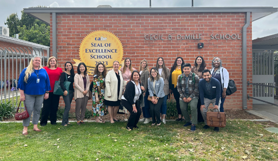 Early Edge California staff pose with 15 Dual Language Learners (DLL) advocacy partners while touring a dual immersion Early Learning program at a Westminster school