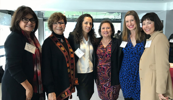 Executive Director Patricia Lozano poses with the conference’s keynote speaker, Dr. Dina Castro, and other attendees.