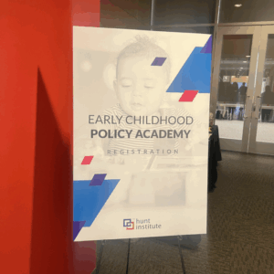 A sign with logo that was posted at the Early Childhood Policy Academy event.