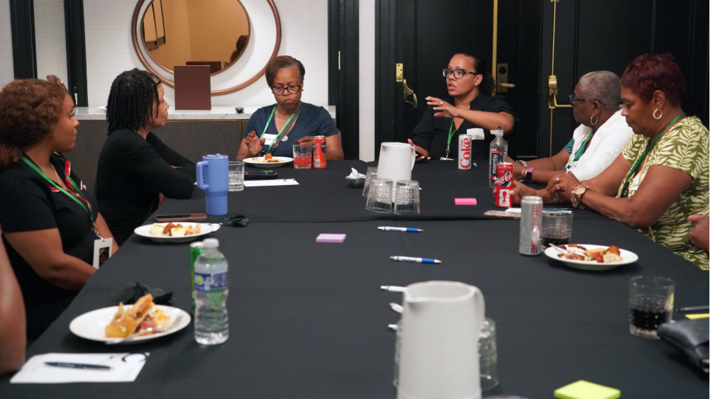 Attendees discuss a topic.