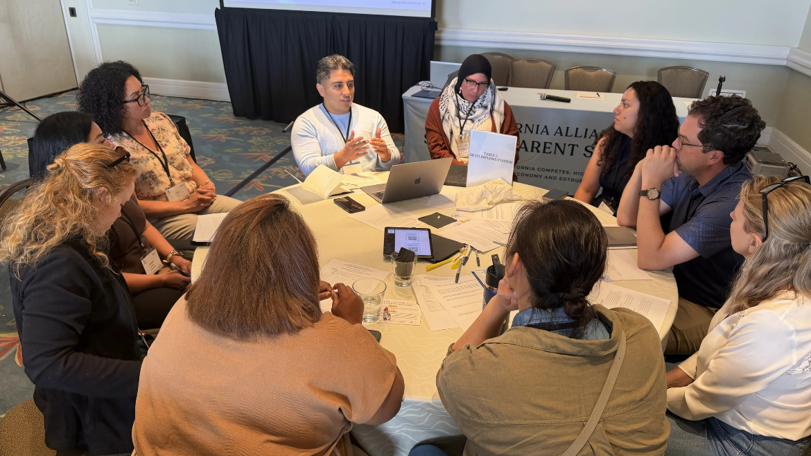Andrew Avila leads a group discussion at conference