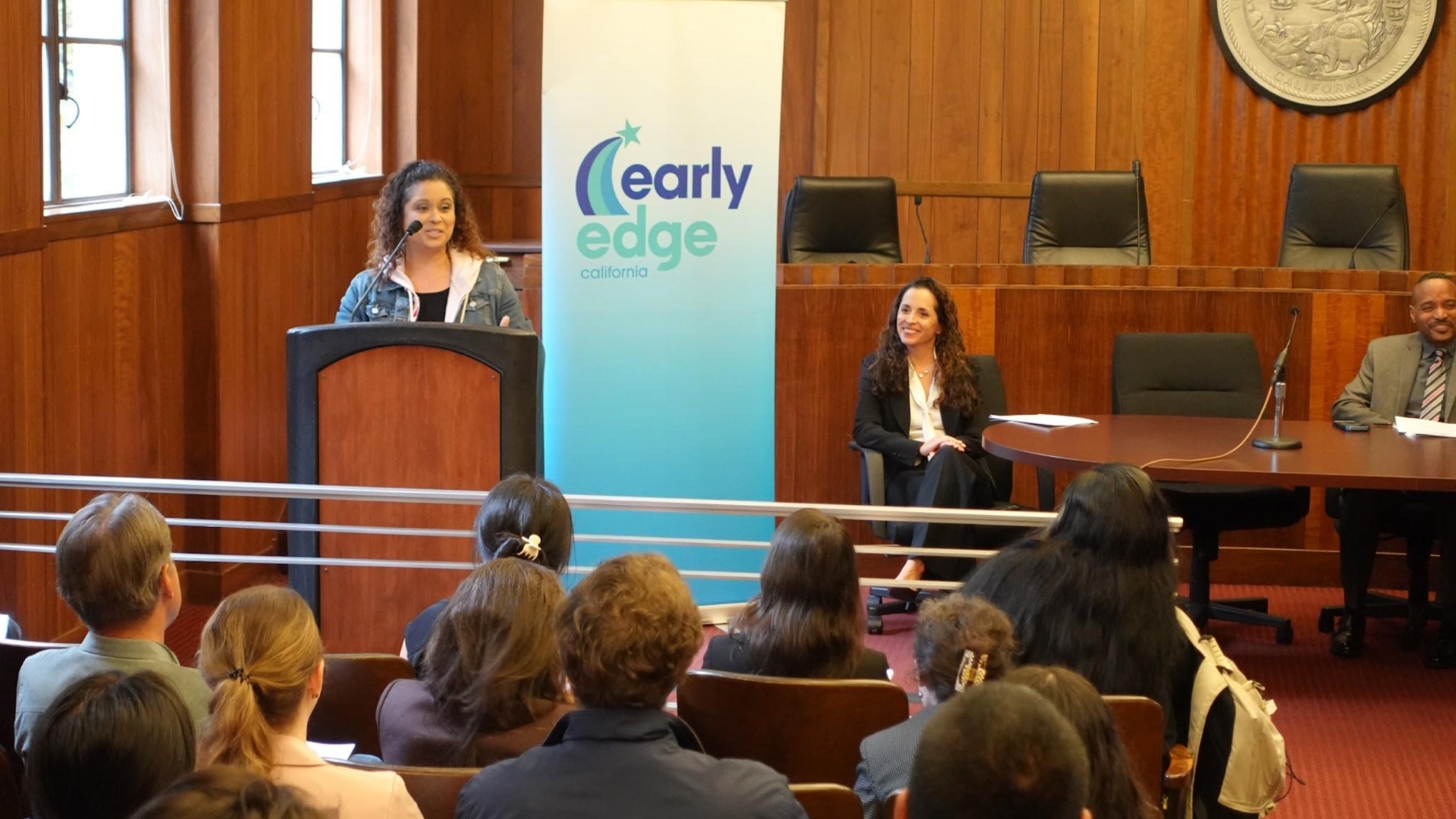 Early Edge ED Patricia Lozano listens to a parent speaker.