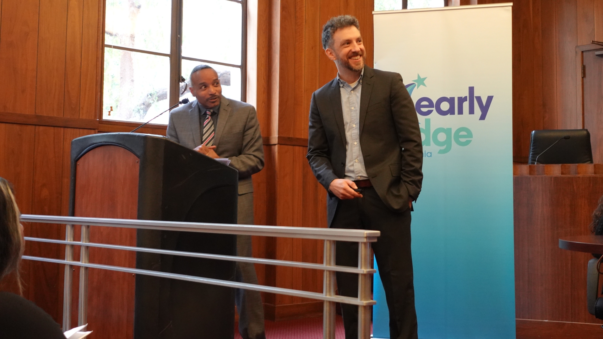 Rucker C. Johnson and Dr. Austin Land co-presenting research findings from the new brief. 