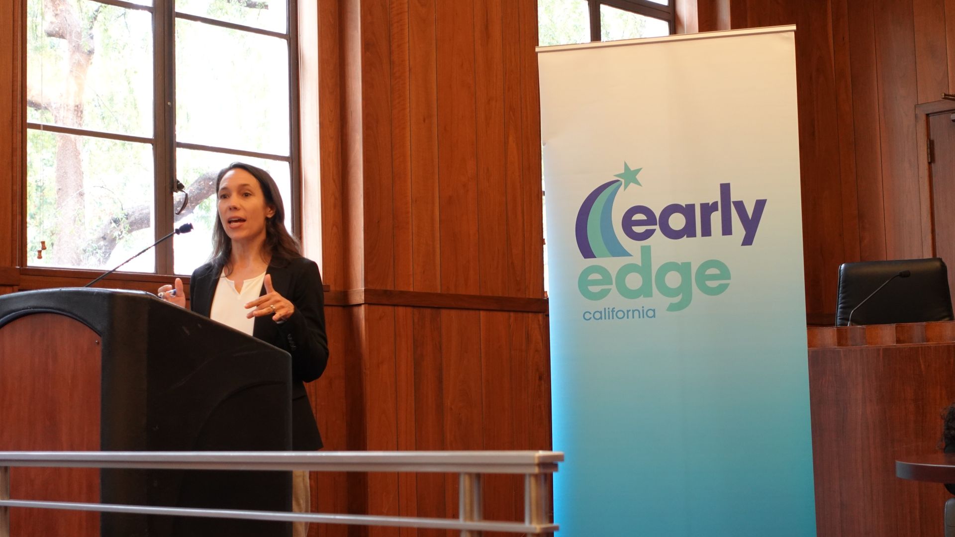 A presenter speaks at the TK Payoff Meeting in Sacramento