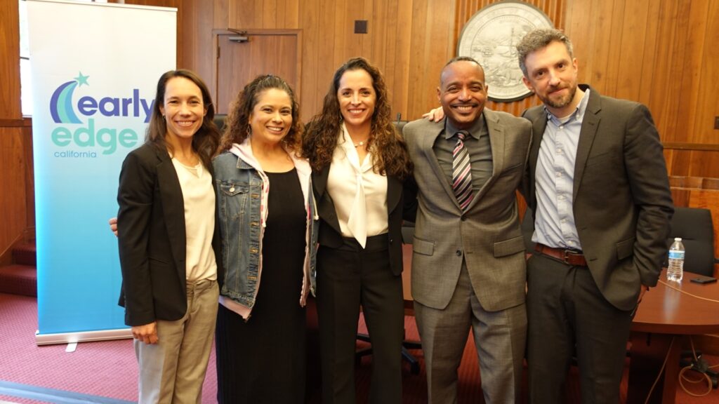 The presenters pose for a picture after the briefing.