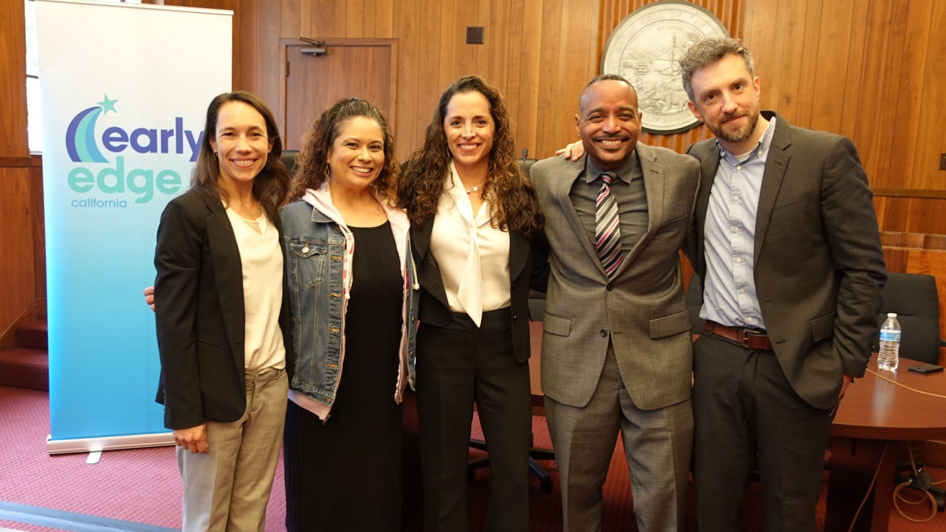 The presenters pose for a picture after the briefing.